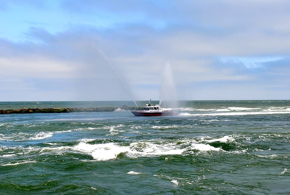 Fire boat spraying water at Indian River Inlet