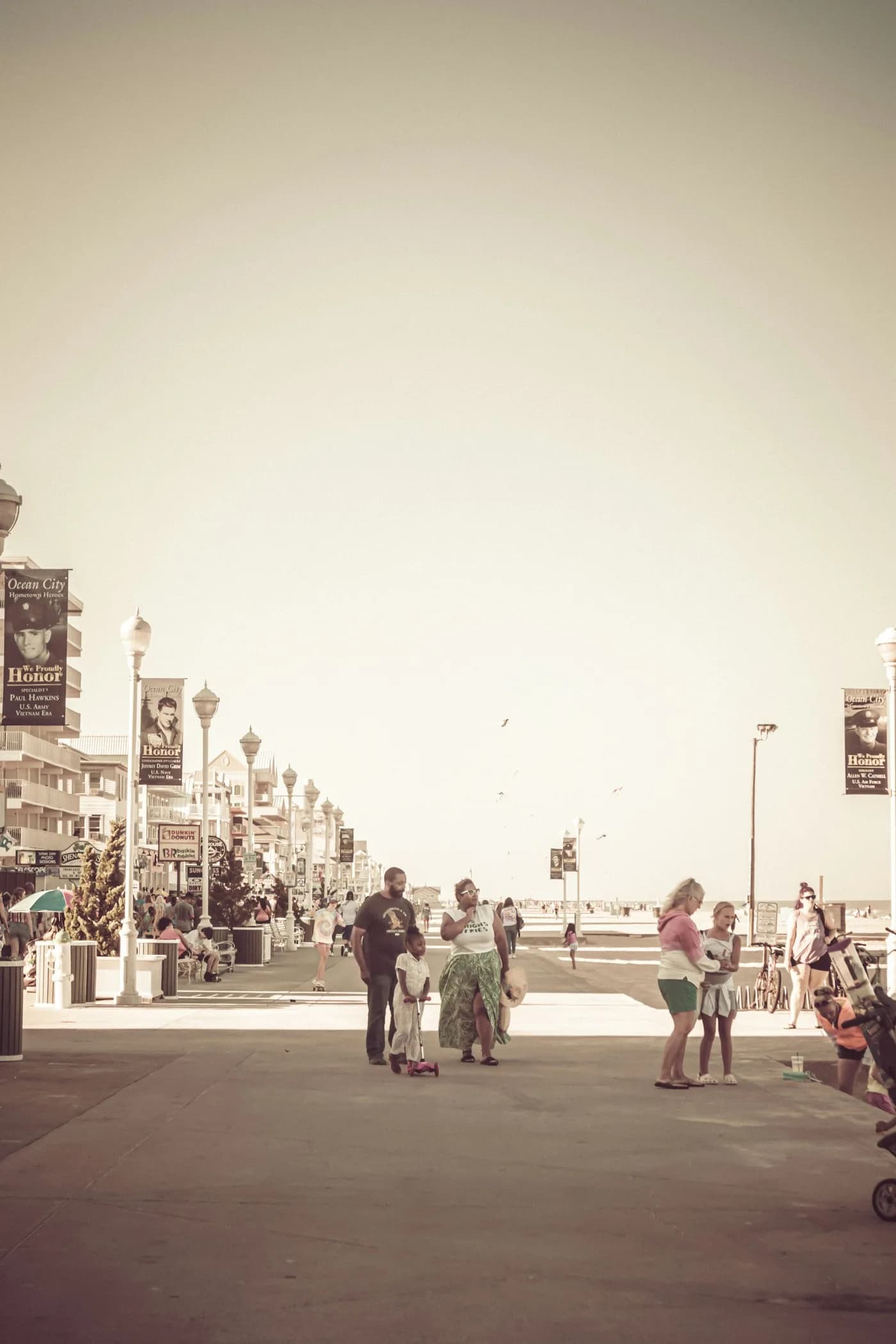 Families strolling the Ocean City Boardwalk near the Atlantic Ocean