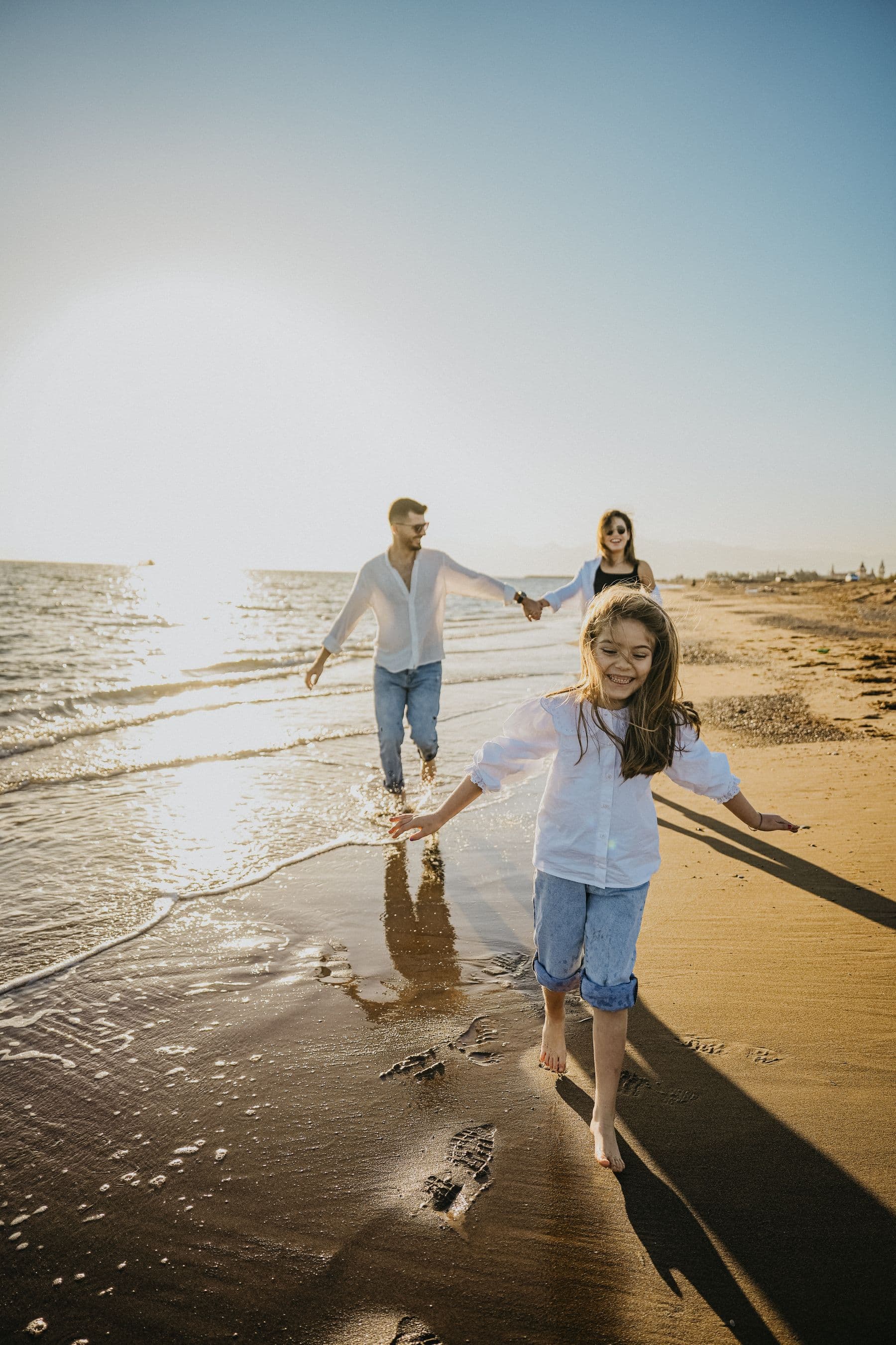 Family walking toward the shoreline in Bethany Beach
