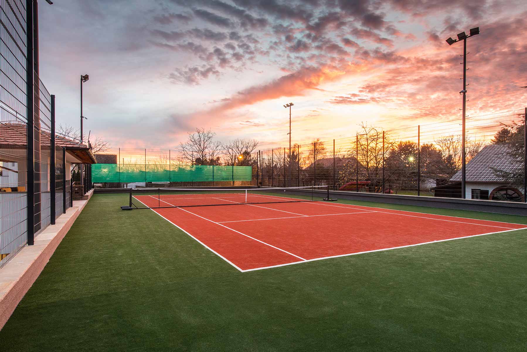 Tennis racquet and ball on a coastal tennis court